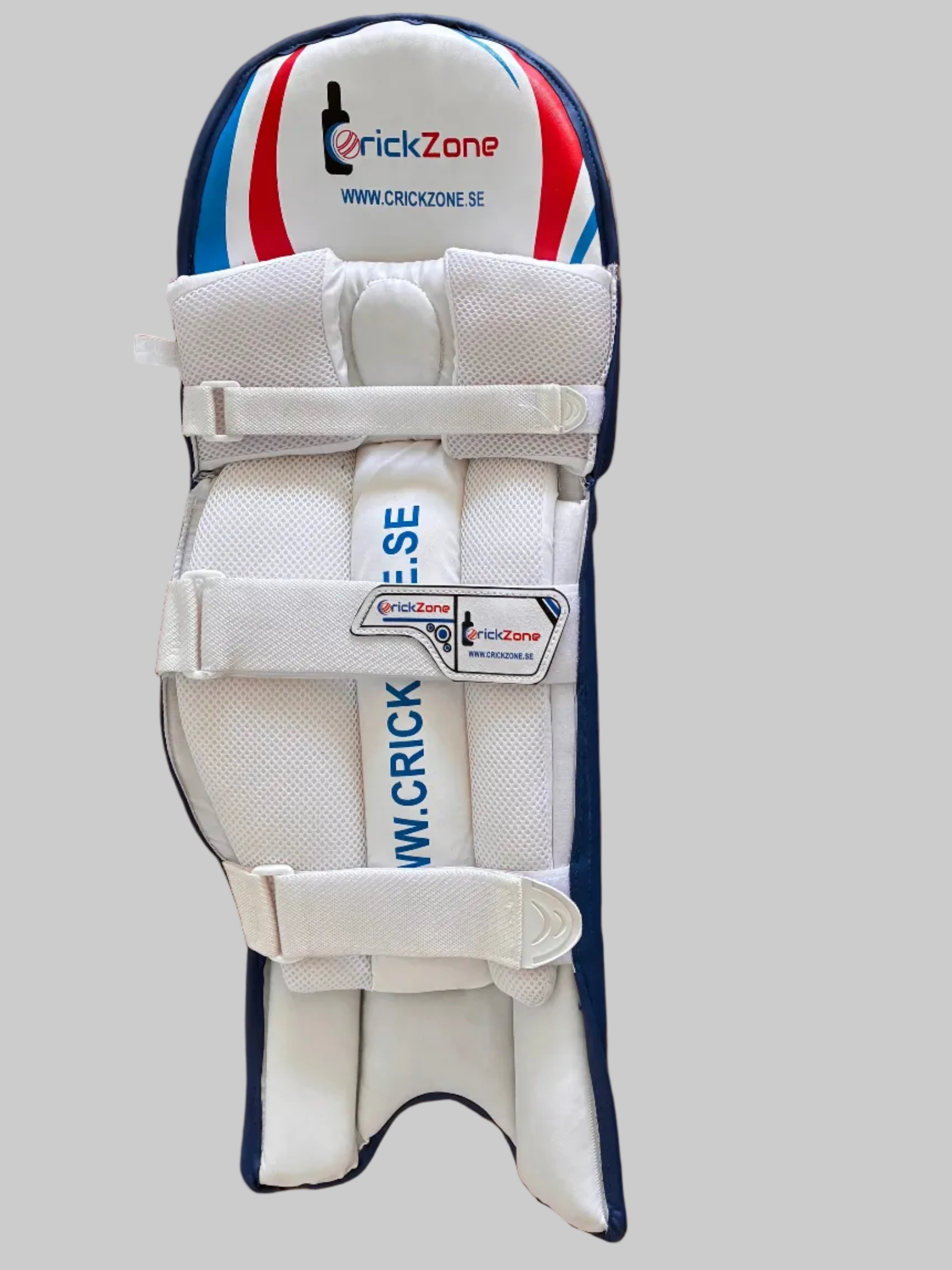 White protective gear with red, blue, and black accents on a wooden floor.